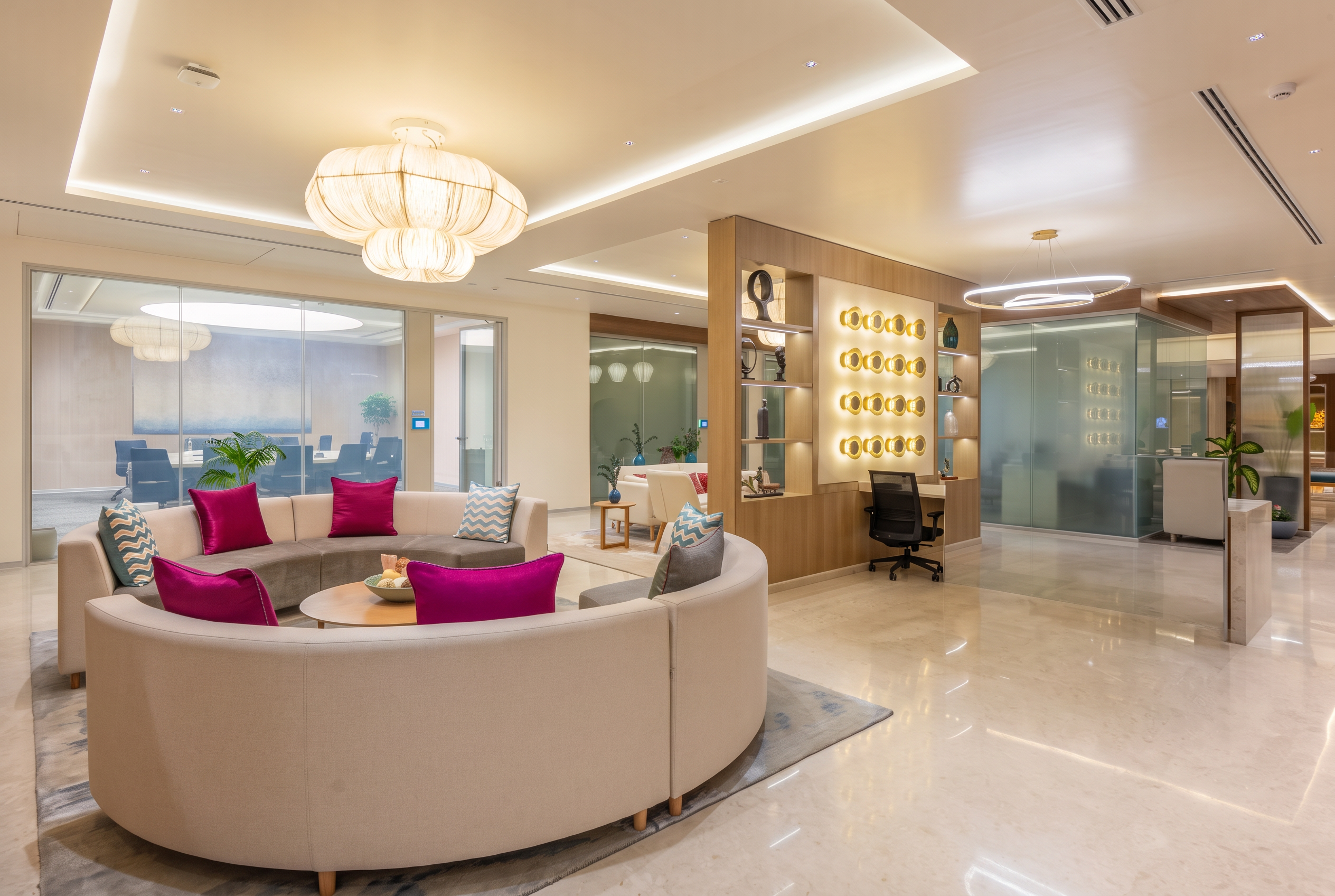 Awfis workspace lounge with a curved sofa and feature lighting