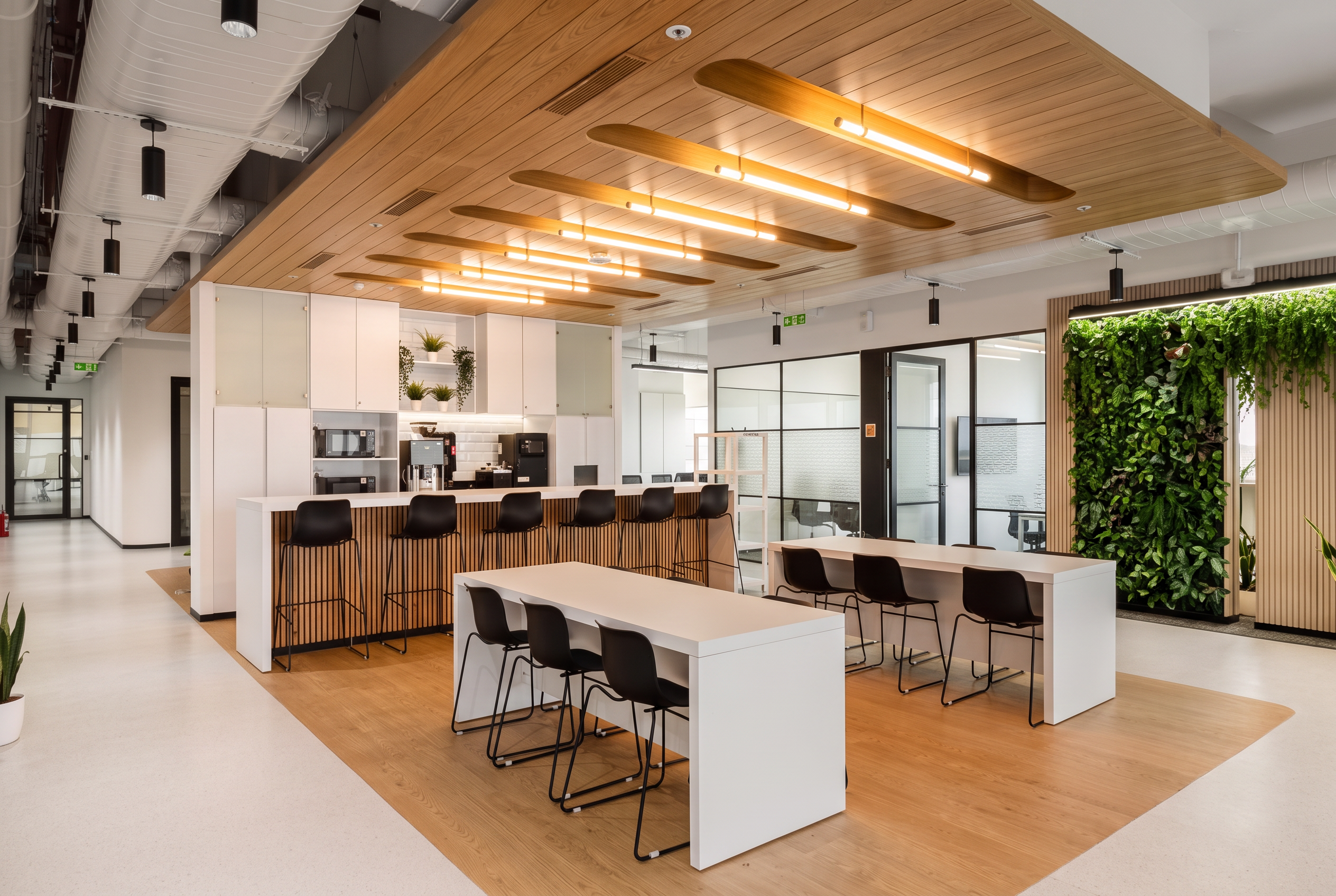 Awfis Transform office with a cafeteria counter and shared tables